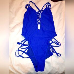NWOT STRAPPY ONE PIECE.  HIGH LEG V LOW CUT V FRONT STRAPPY BACK
